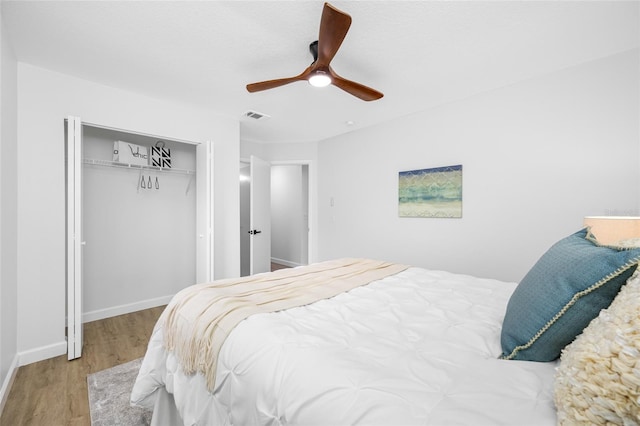 3927 Spence Ave, Tampa, FL 33614 - bedroom featuring wood finished floors, a closet, a ceiling fan, and baseboards