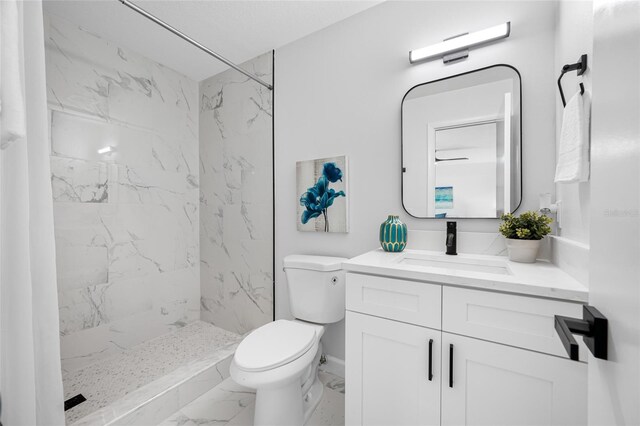 3927 Spence Ave, Tampa, FL 33614 - bathroom featuring marble finish flooring, toilet, vanity, and a marble finish shower