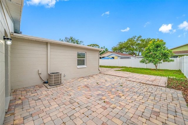 3927 Spence Ave, Tampa, FL 33614 - fenced backyard with central air condition unit and a patio