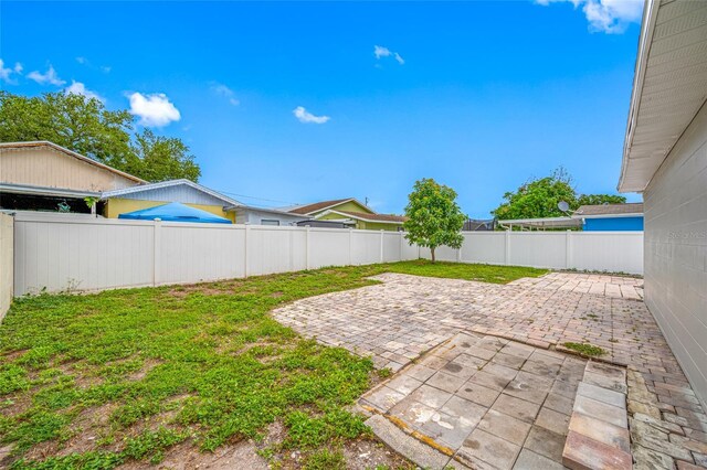 3927 Spence Ave, Tampa, FL 33614 - view of yard featuring a patio area