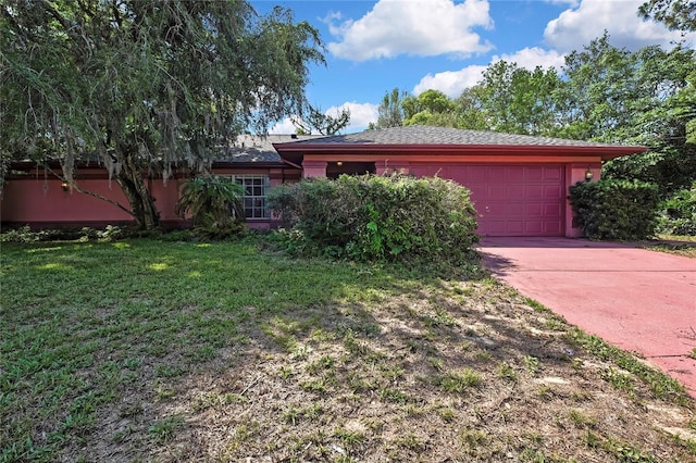 4388 Tiffin Ave, Spring Hill, FL 34609 - view of front of property featuring an attached garage, concrete driveway, and a front yard