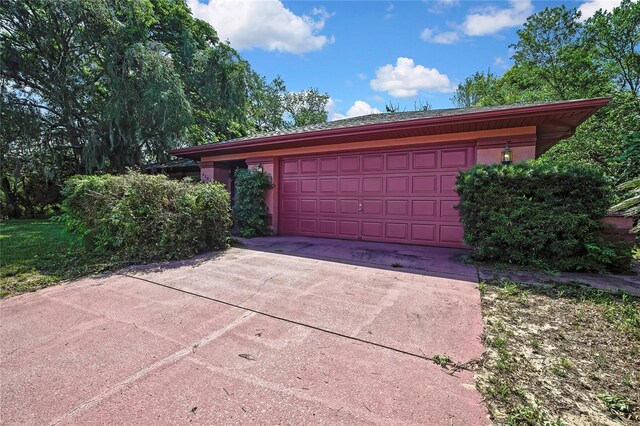 4388 Tiffin Ave, Spring Hill, FL 34609 - garage featuring driveway
