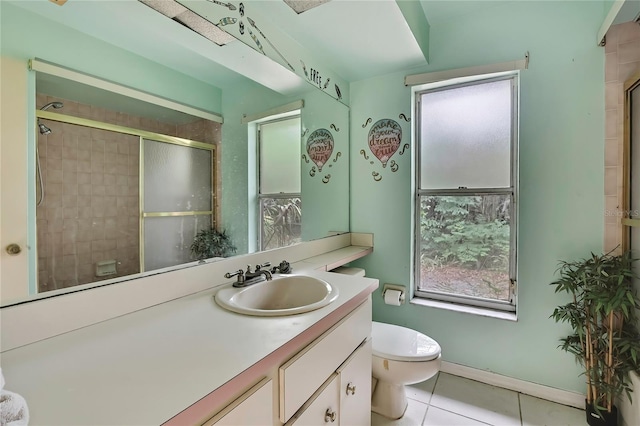 4388 Tiffin Ave, Spring Hill, FL 34609 - full bathroom with toilet, tile patterned flooring, vanity, and an enclosed shower
