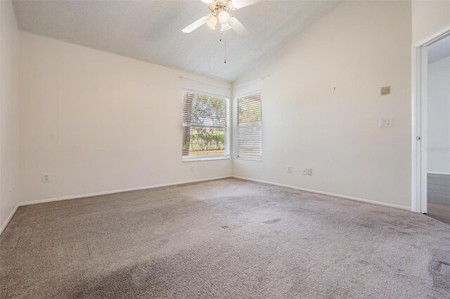 2355 Bentley Dr, Palm Harbor, FL 34684 - carpeted spare room featuring ceiling fan, baseboards, and high vaulted ceiling