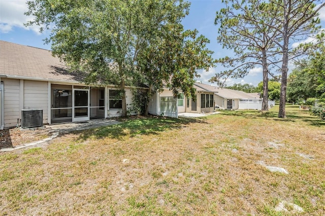 2355 Bentley Dr, Palm Harbor, FL 34684 - view of grassy yard with central air condition unit