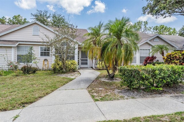 2355 Bentley Dr, Palm Harbor, FL 34684 - view of front of home with a front yard