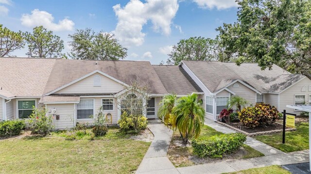2355 Bentley Dr, Palm Harbor, FL 34684 - view of front of house with a front yard