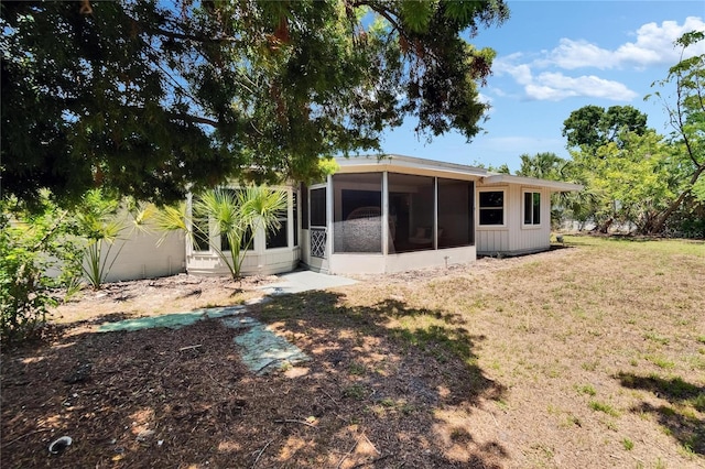 4502 19th Street Cir W, Bradenton, FL 34207 - back of property with a sunroom and a lawn