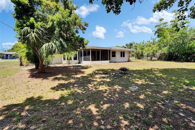 4502 19th Street Cir W, Bradenton, FL 34207 - back of property featuring a sunroom and a yard