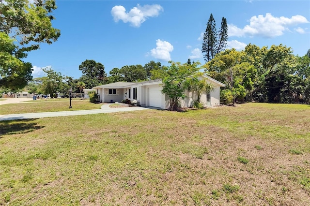 4502 19th Street Cir W, Bradenton, FL 34207 - view of green lawn with an attached garage and concrete driveway