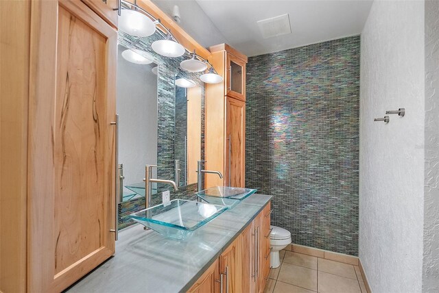400 4th Ave S Unit 508, Saint Petersburg, FL 33701 - bathroom featuring tile patterned flooring, toilet, and vanity