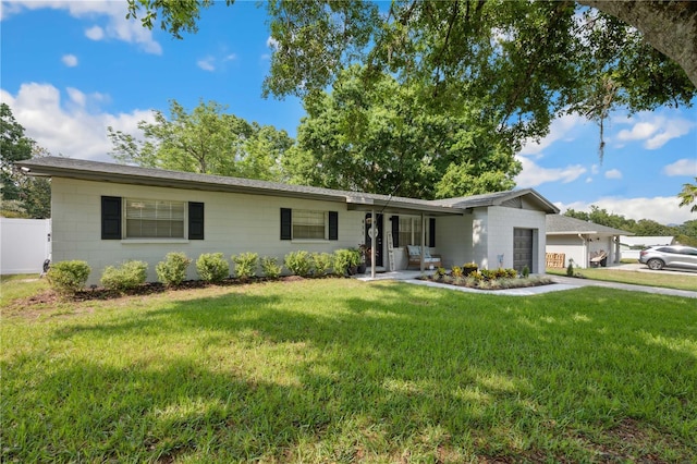 811 Patricia Pl, Lakeland, FL 33809 - ranch-style house featuring a garage, a front yard, and concrete driveway