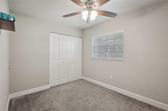 811 Patricia Pl, Lakeland, FL 33809 - unfurnished bedroom featuring carpet flooring, a closet, baseboards, and ceiling fan