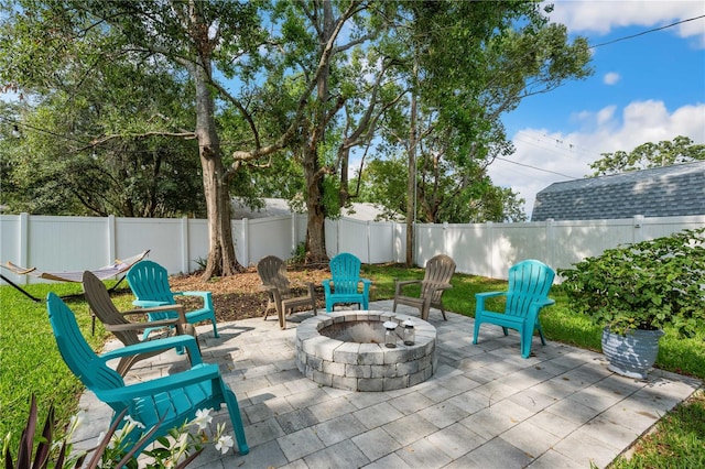 811 Patricia Pl, Lakeland, FL 33809 - fenced backyard with a fire pit and a patio