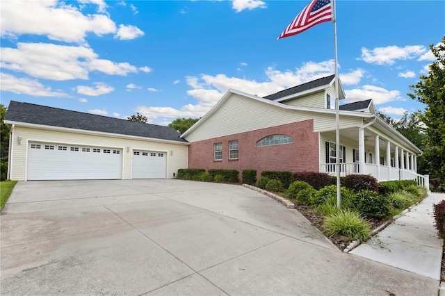 9830 Caribou Trl, Dade City, FL 33525 - view of side of property featuring driveway, covered porch, and an outbuilding