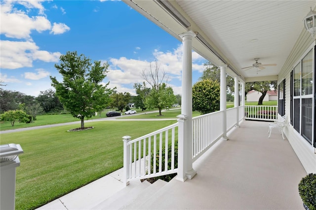 9830 Caribou Trl, Dade City, FL 33525 - porch featuring a ceiling fan and a yard
