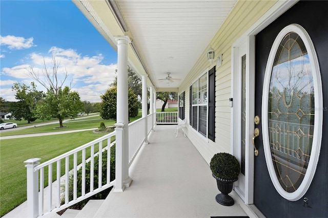 9830 Caribou Trl, Dade City, FL 33525 - covered porch featuring a yard and a ceiling fan