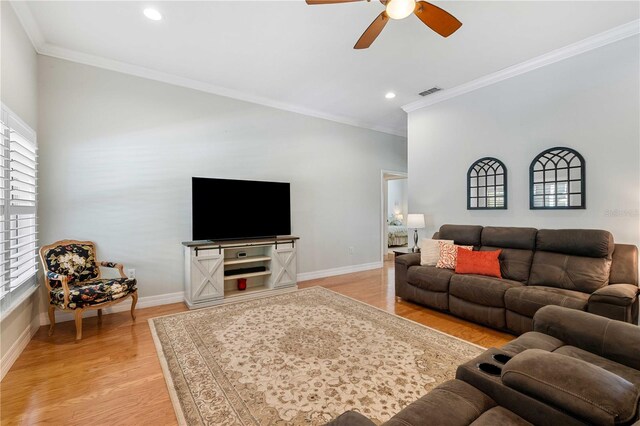 9830 Caribou Trl, Dade City, FL 33525 - living area with a ceiling fan, crown molding, light wood-type flooring, recessed lighting, and baseboards