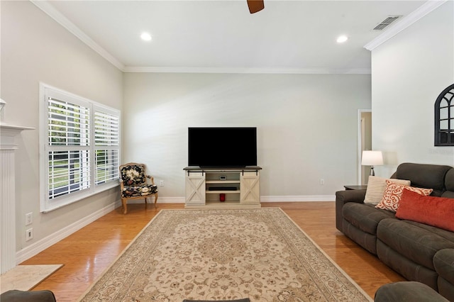 9830 Caribou Trl, Dade City, FL 33525 - living area with wood finished floors, crown molding, a ceiling fan, recessed lighting, and baseboards