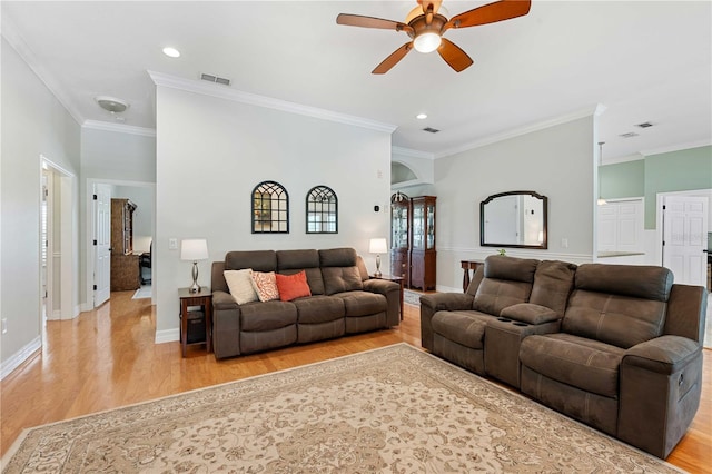 9830 Caribou Trl, Dade City, FL 33525 - living area featuring ceiling fan, light wood finished floors, crown molding, and recessed lighting