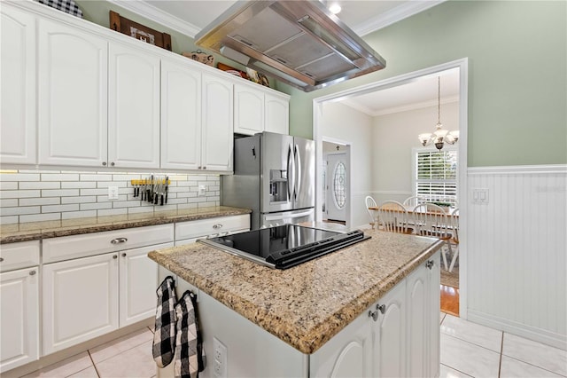 9830 Caribou Trl, Dade City, FL 33525 - kitchen featuring stainless steel refrigerator with ice dispenser, ventilation hood, ornamental molding, light tile patterned floors, and black electric stovetop