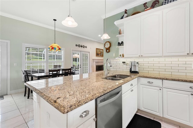 9830 Caribou Trl, Dade City, FL 33525 - kitchen with stainless steel dishwasher, a sink, a peninsula, open shelves, and crown molding