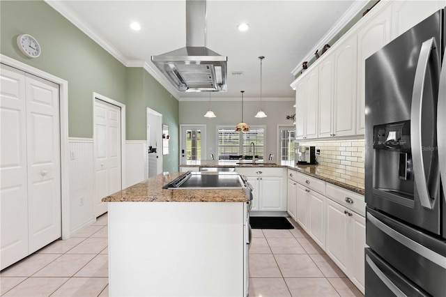 9830 Caribou Trl, Dade City, FL 33525 - kitchen with stainless steel refrigerator with ice dispenser, exhaust hood, a sink, light tile patterned floors, and ornamental molding