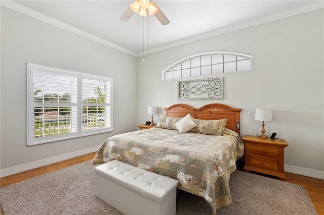 9830 Caribou Trl, Dade City, FL 33525 - bedroom featuring crown molding, baseboards, wood finished floors, and ceiling fan