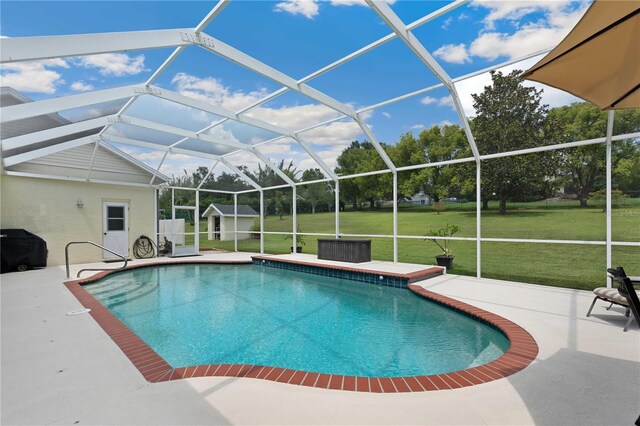 9830 Caribou Trl, Dade City, FL 33525 - swimming pool with a patio area, a lawn, and a lanai