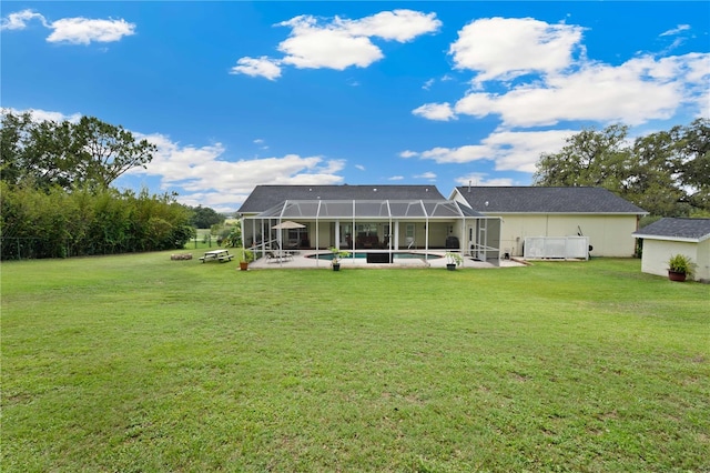 9830 Caribou Trl, Dade City, FL 33525 - rear view of property with a patio area, a yard, an outdoor pool, and glass enclosure