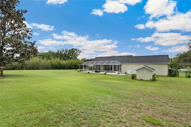 9830 Caribou Trl, Dade City, FL 33525 - view of green lawn featuring an outdoor pool and a lanai