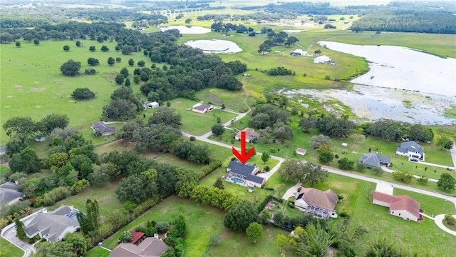 9830 Caribou Trl, Dade City, FL 33525 - aerial overview of property's location with a large body of water and nearby suburban area