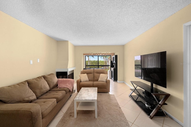 1905 Oyster Catcher Ln Unit 924, Clearwater, FL 33762 - living area featuring light tile patterned flooring and a textured ceiling