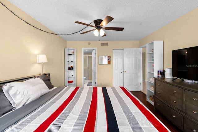 1905 Oyster Catcher Ln Unit 924, Clearwater, FL 33762 - bedroom featuring a textured ceiling, connected bathroom, and ceiling fan