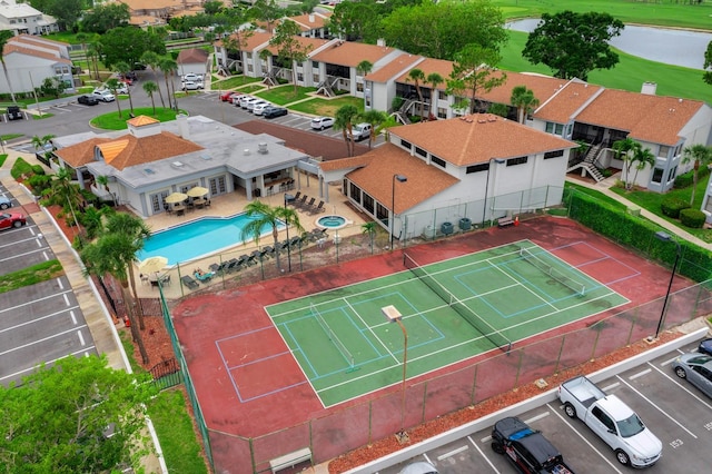 1905 Oyster Catcher Ln Unit 924, Clearwater, FL 33762 - drone / aerial view of a pool area and a nearby body of water