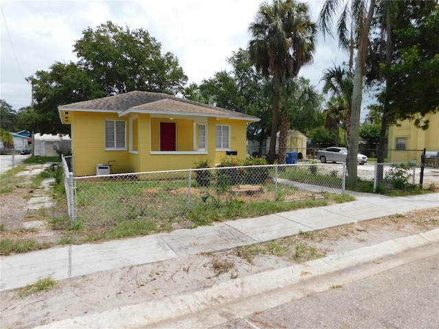 844 20th St S, Saint Petersburg, FL 33712 - bungalow-style home with a fenced front yard and roof with shingles