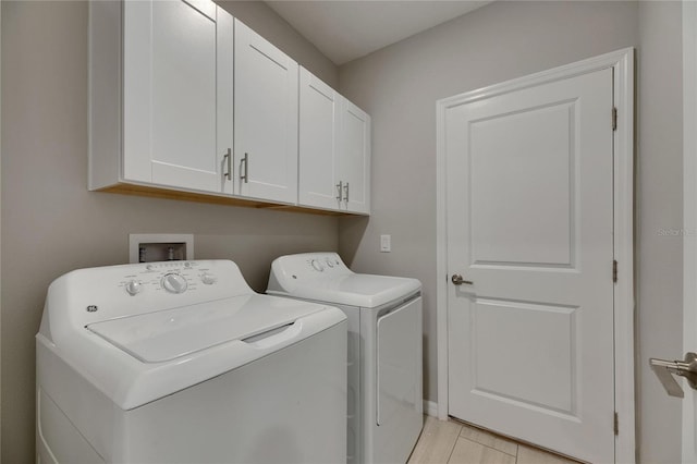 12617 Maple Bonsai Dr, Riverview, FL 33579 - laundry area with cabinet space, separate washer and dryer, and light wood-style flooring