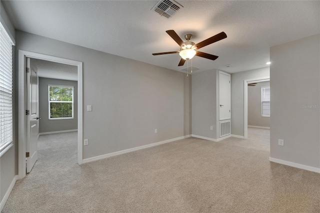 12617 Maple Bonsai Dr, Riverview, FL 33579 - empty room with light colored carpet, a ceiling fan, and baseboards