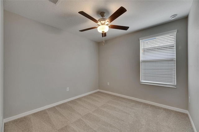 12617 Maple Bonsai Dr, Riverview, FL 33579 - spare room with light carpet, a ceiling fan, and baseboards