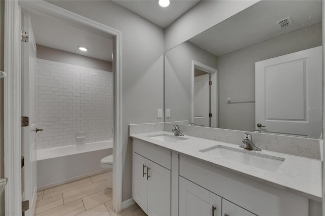 12617 Maple Bonsai Dr, Riverview, FL 33579 - bathroom with toilet, double vanity, tile patterned flooring, and bathtub / shower combination