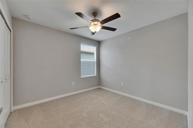 12617 Maple Bonsai Dr, Riverview, FL 33579 - unfurnished bedroom with a closet, light carpet, baseboards, and a textured ceiling