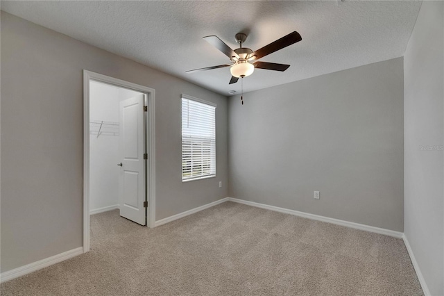 12617 Maple Bonsai Dr, Riverview, FL 33579 - empty room with ceiling fan, light colored carpet, baseboards, and a textured ceiling