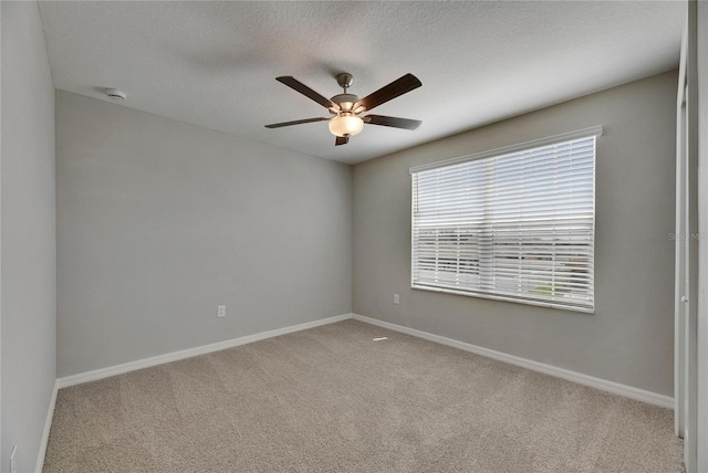 12617 Maple Bonsai Dr, Riverview, FL 33579 - unfurnished room featuring carpet, a ceiling fan, baseboards, a smoke detector, and a textured ceiling