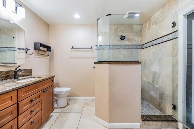 10954 96th St, Largo, FL 33773 - full bathroom with walk in shower, vanity, toilet, baseboards, and tile patterned flooring