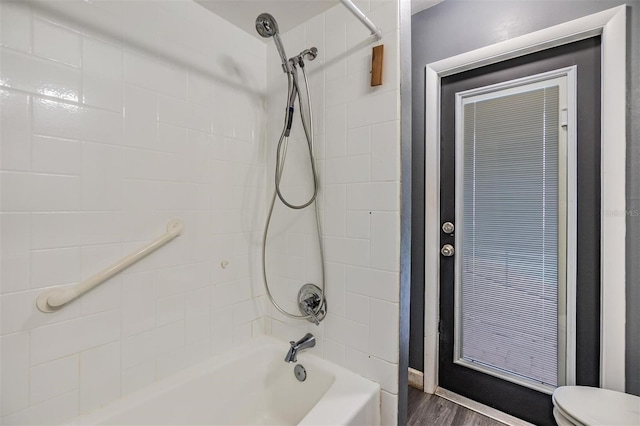 10954 96th St, Largo, FL 33773 - full bath featuring toilet,  shower combination, and wood finished floors