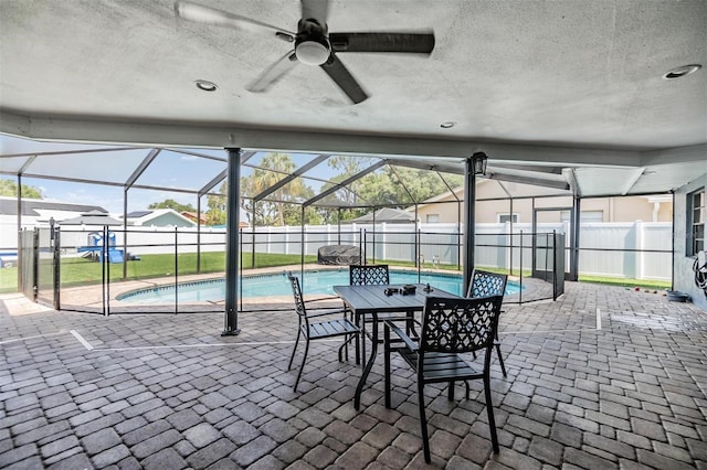 10954 96th St, Largo, FL 33773 - view of pool with a fenced backyard, a patio, a ceiling fan, and glass enclosure