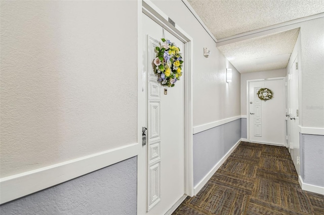 17920 Gulf Blvd Unit 208, Redington Shores, FL 33708 - hallway featuring carpet flooring, a textured ceiling, and baseboards
