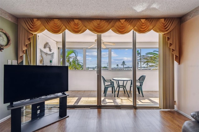 17920 Gulf Blvd Unit 208, Redington Shores, FL 33708 - living room with plenty of natural light, a textured ceiling, and wood finished floors