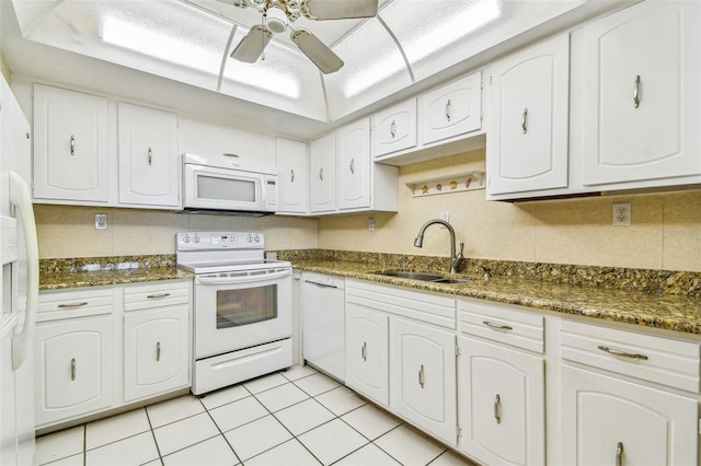 17920 Gulf Blvd Unit 208, Redington Shores, FL 33708 - kitchen with white appliances, a sink, white cabinetry, ceiling fan, and light tile patterned floors