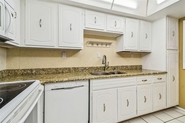17920 Gulf Blvd Unit 208, Redington Shores, FL 33708 - kitchen featuring white appliances, a sink, backsplash, and white cabinets